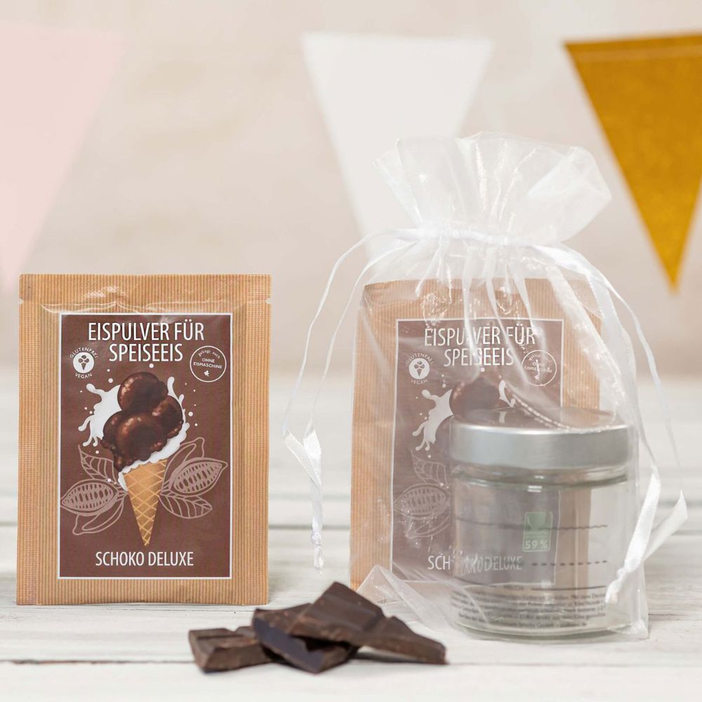 Eismixglas und Portionsbeutel im transparenten Säckchen